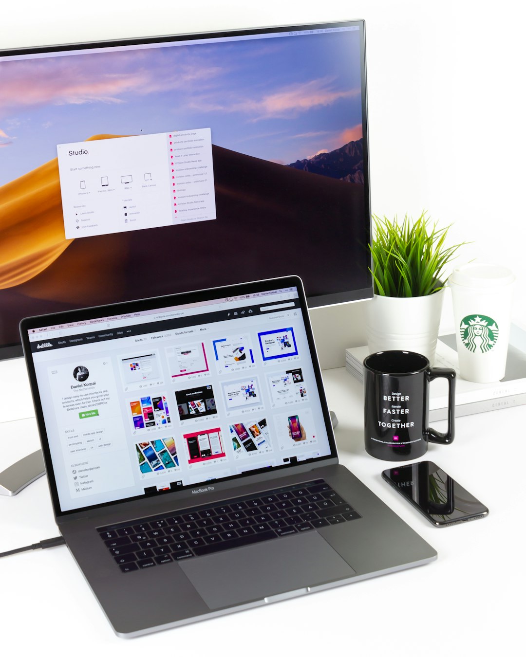 laptop-near-mug-and-computer-monitor-8wjfjqnb-90